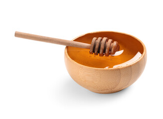 Wooden bowl with sweet honey and dipper on white background