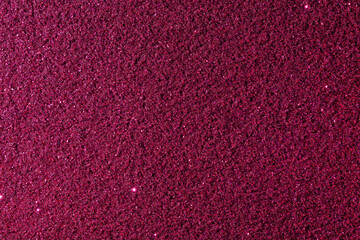 A close up of a red background with a lot of small dots