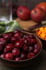 Tasty cherries and other fruits on wooden table, closeup