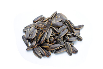 Roasted sunflower seeds on white background.