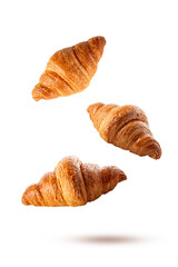 Croissants falling isolated on white background