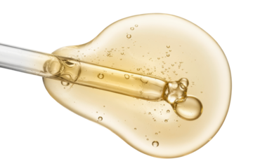 golden serum droplet with pipette on white background