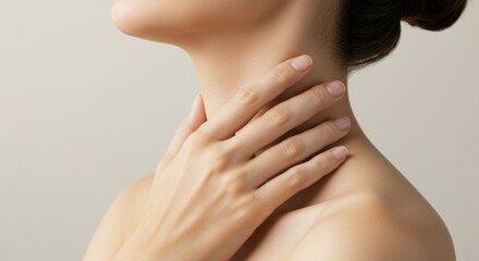 Elegant woman's neck and shoulder with hand resting gently again