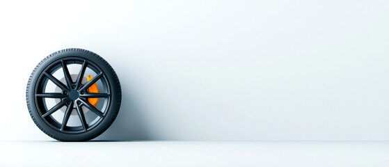 A sleek, modern tire is positioned against a minimalist white background, highlighting its design and features.