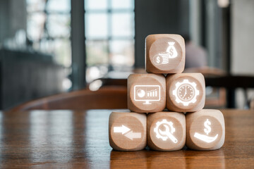 Wooden blocks with economic icons symbolize GDP growth, financial success, and business strategy in a modern setting.