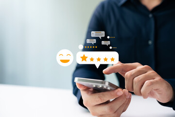 Customer satisfaction survey, consumers use smartphones via online applications to rate 5 stars for excellent service and product quality, increasing business credibility and reputation.
