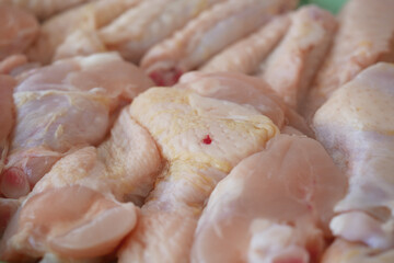 Fresh chicken pieces ready for cooking at a local market