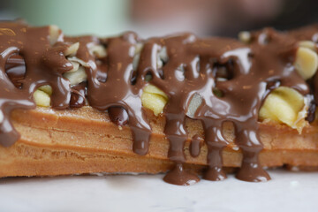 Decadent dessert with chocolate and banana on pastry treat