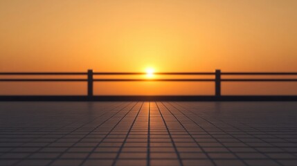 Obraz premium A serene sunset view with a warm orange glow, framed by a railing and reflecting on a tiled surface, creating a tranquil atmosphere.