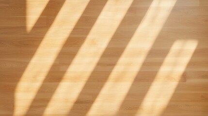 A warm wooden floor with soft shadows creating a dynamic pattern, highlighting the natural grain and texture of the wood.
