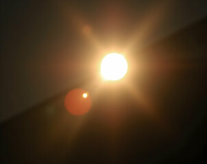 Abstract Lens Flare with Glowing Orb and Blurred Edges, A Radiant Display of Light and Shadow, Perfect for Backgrounds and Creative Visuals