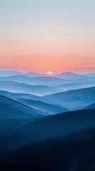 Fototapeta premium A beautiful mountain range with a sun setting in the background