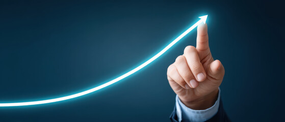 hand in formal suit touches glowing upward curve, symbolizing growth and success. This conveys ambition and progress