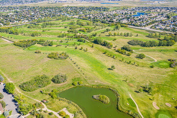 Golf course with a pond in the middle