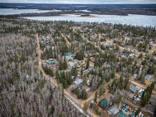 Small town with houses and a lake in the background