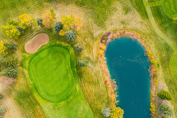 Golf course with a pond in the middle