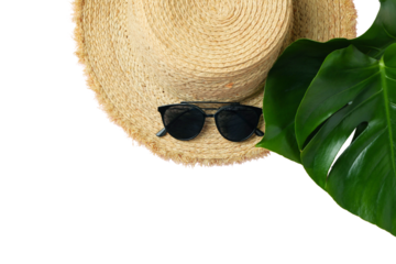 Summer vibes: straw hat and sunglasses among tropical leaves, isolated on white, PNG