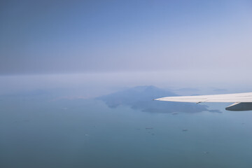 View of Serene Islands and Ocean Horizon from Airplane