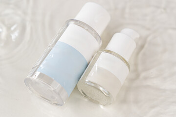 Showcase of skincare bottles on the water