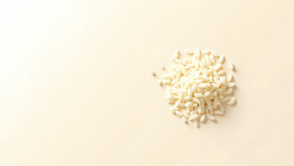 Minimalist Grainy Rice Mockup, An Overhead Still Life Featuring Scattered Rice Grains on a Soft, Neutral Background with Copy Space for Culinary or Dietary Themes