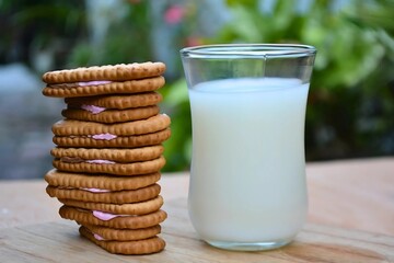 A glass of milk and cookies