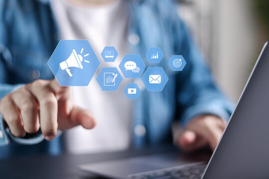 Public relations (PR) concept. Media relations, marketing and publicity. Person using laptop with PR icons on virtual screen.