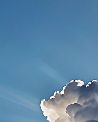 Sunlit Cumulus Clouds Against a Blue Sky