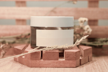 Skincare bottle showcase with wood and dried flower decoration