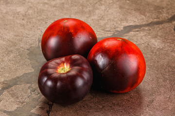 Black ripe juicy organic tomato