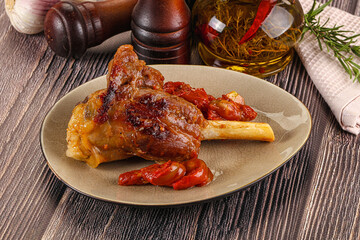Baked lamb shank with vegetables