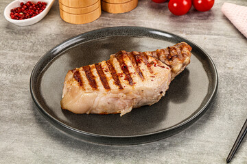 Grilled pork loin steak with bone