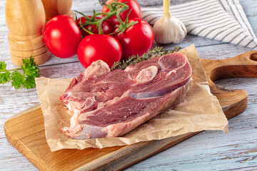 Raw lamb steak with bone