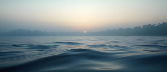 Fototapeta premium Misty Sunrise Over Water