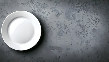 White plate on left side of gray concrete background using &frac34; Camera Angle Perspective