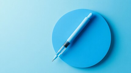 Light Blue Pen on Circular Paper Background Minimalist Office Stationery Design