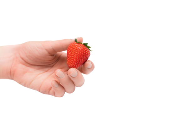 Strawberry in female hand isolated on a transparent background