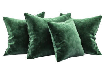 Luxurious emerald green velvet throw pillows elegantly arranged against a stark black background showcasing their plush texture and rich on transparent background