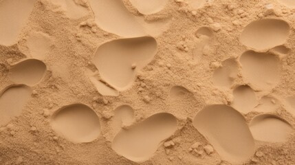 A sandy beach with footprints in the sand