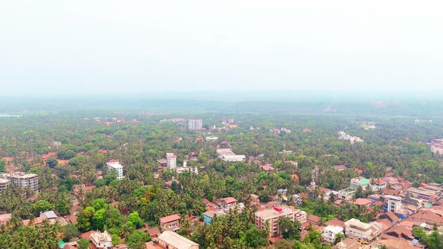 Aerial shot greenery blending town and farmland