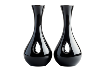 Elegant pair of black ceramic vases with teardrop cutouts a sophisticated home decor statement piece against a stark black on transparent background