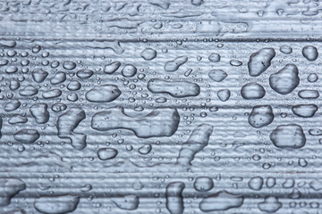 Close-up of strips of duct tape, or gaffer tape, background with water droplets on top. Strong...