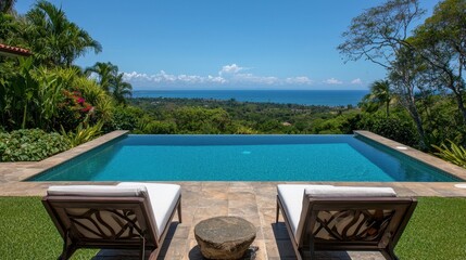 Obraz premium Luxurious Poolside View Overlooking Scenic Ocean and Greenery