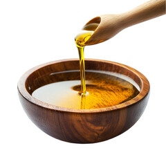 Golden oil pouring into wooden bowl healthy cooking ingredient