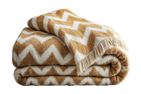Luxurious golden and ivory chevron throw blanket softly folded showcasing its intricate zig zag pattern and plush texture against a black on transparent background