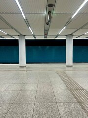 Interior of subway station in modern style with tactile paving on the floor for blind people.