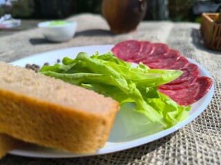 Pieces of traditional massage on a white plate on a wooden table. High quality photo