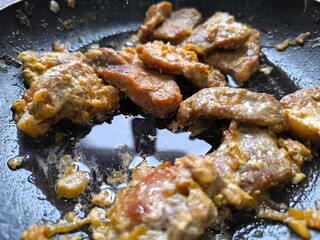 Frying sliced ​​meat on the stove, making goulash or stew