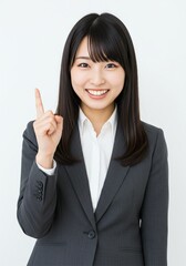 beautiful young woman wearing office clothes with expression has found an idea with hand pointing up happy face