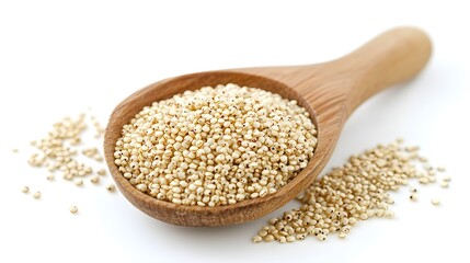 A wooden spoon overflowing with uncooked white quinoa grains sits on a pristine white background ready for cooking.