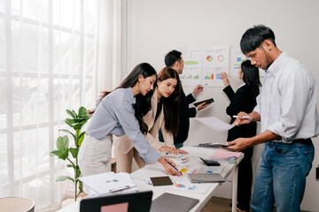 Modern youth are gathering, working as a team, and holding team meetings to achieve their goals.